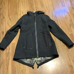 Mondetta medium black hi-low rain jacket.